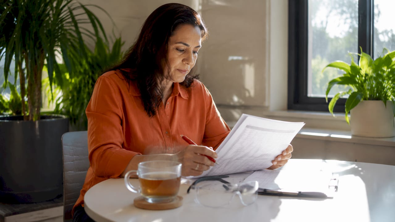 Project manager reviewing vendor list document