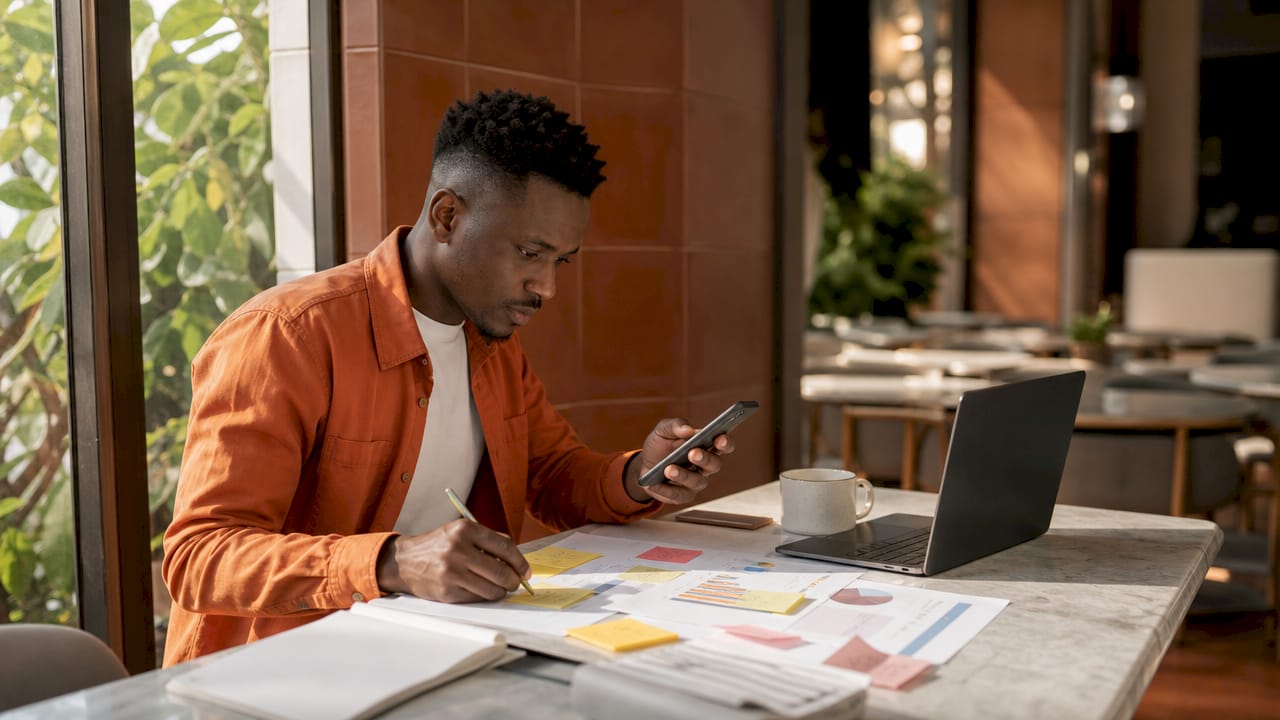 Contractor planning marketing strategy with notes