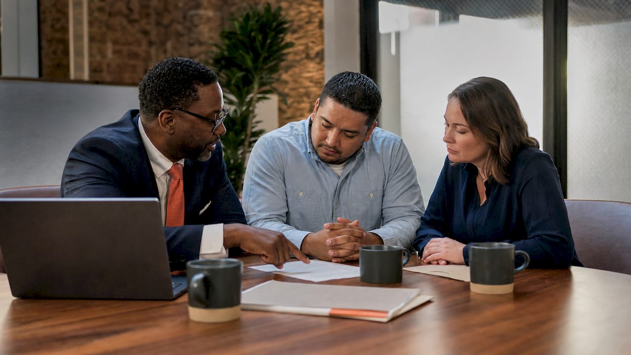 Contractor and bonding agent discussing contract