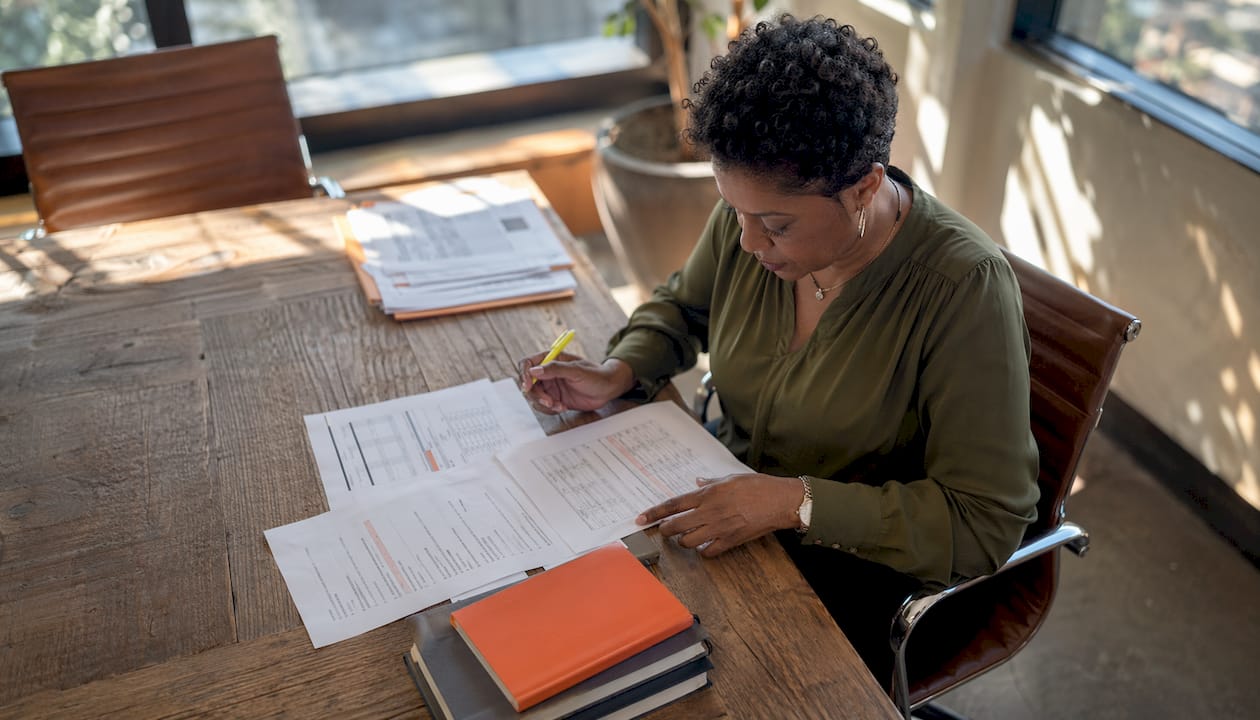 Contractor reviewing bid proposal documents