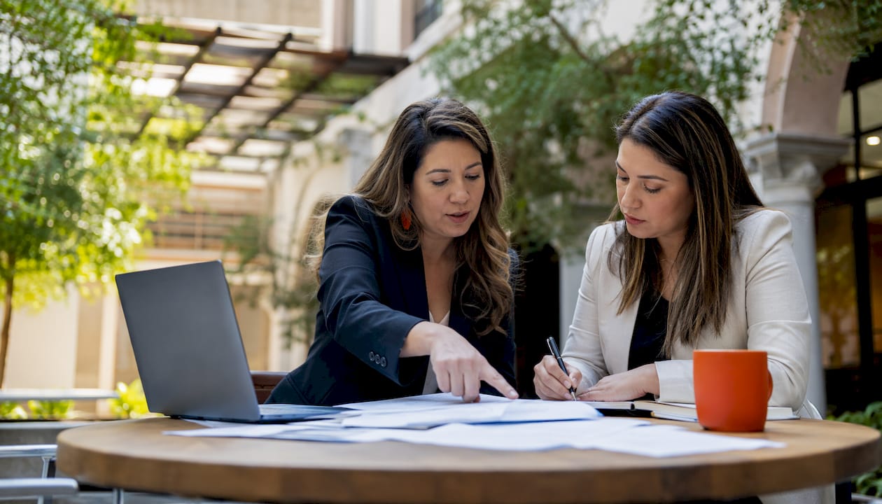 Construction consultants reviewing bid documents together