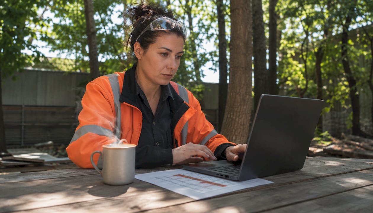 Contractor working on lifecycle software laptop