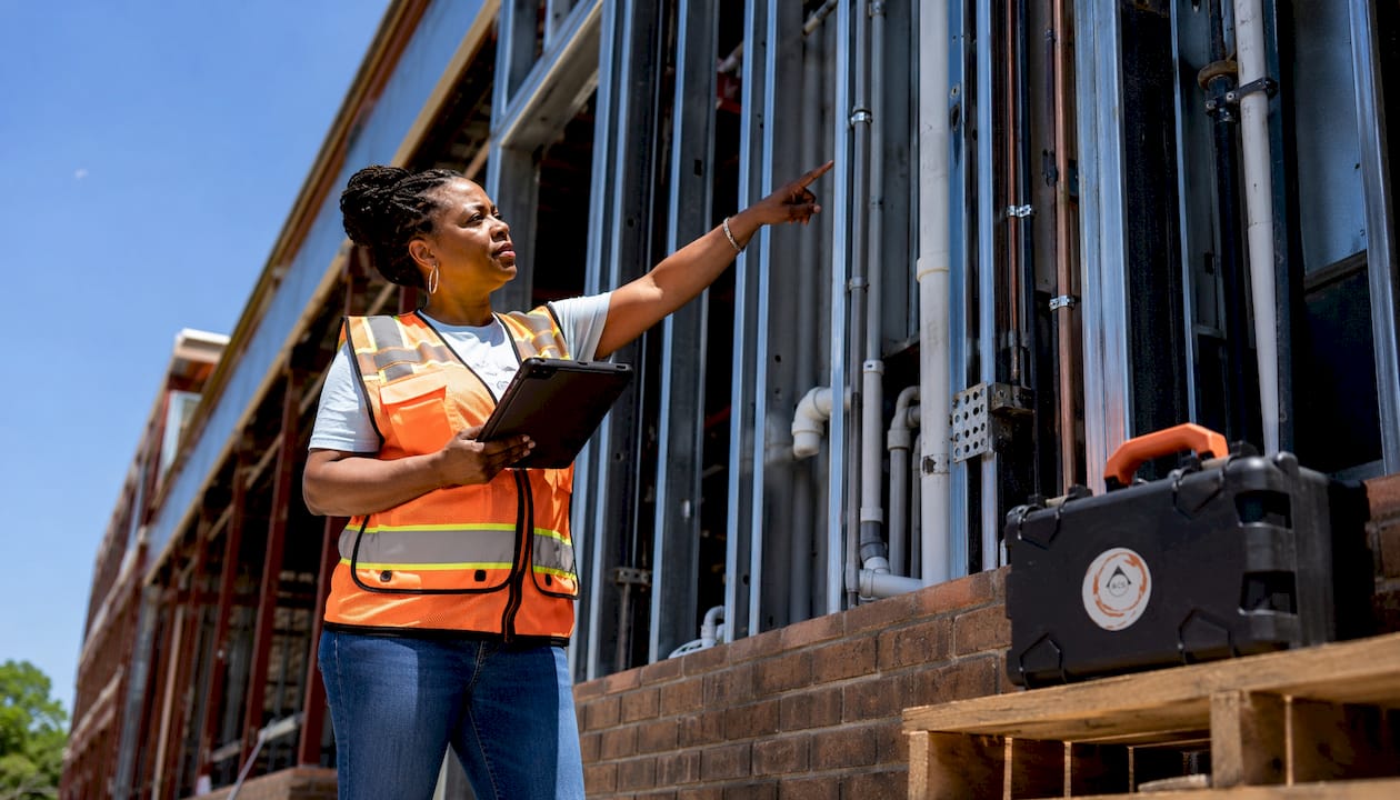 Building inspector evaluating electrical conduits