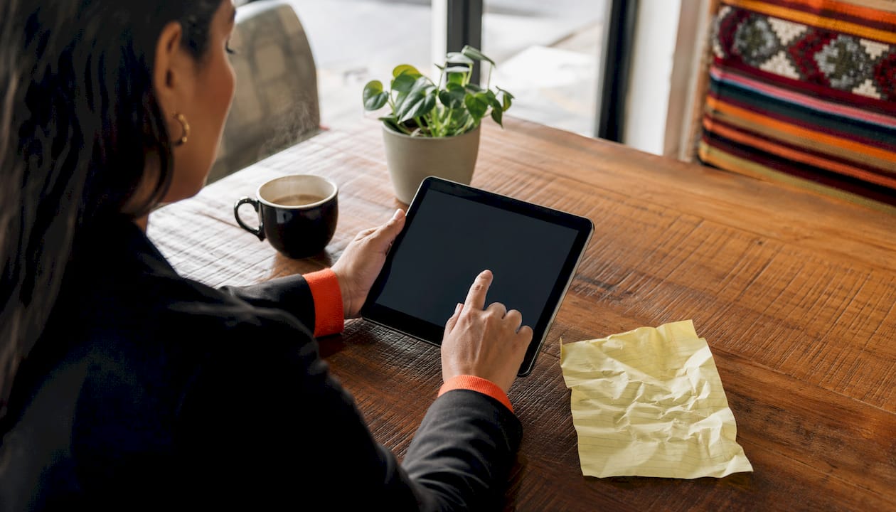 Hands interacting with lead conversion CRM data