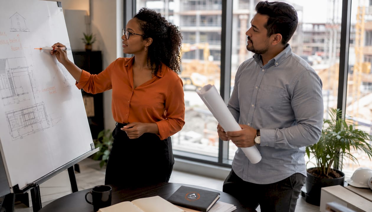 Two managers conducting a project manager interview in trailer