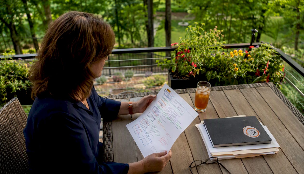 Project manager reviewing workflow documents
