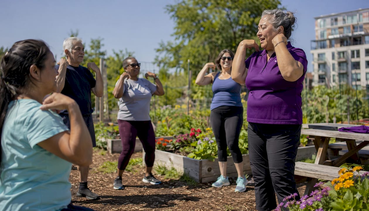 Community health worker leading bone health exercises