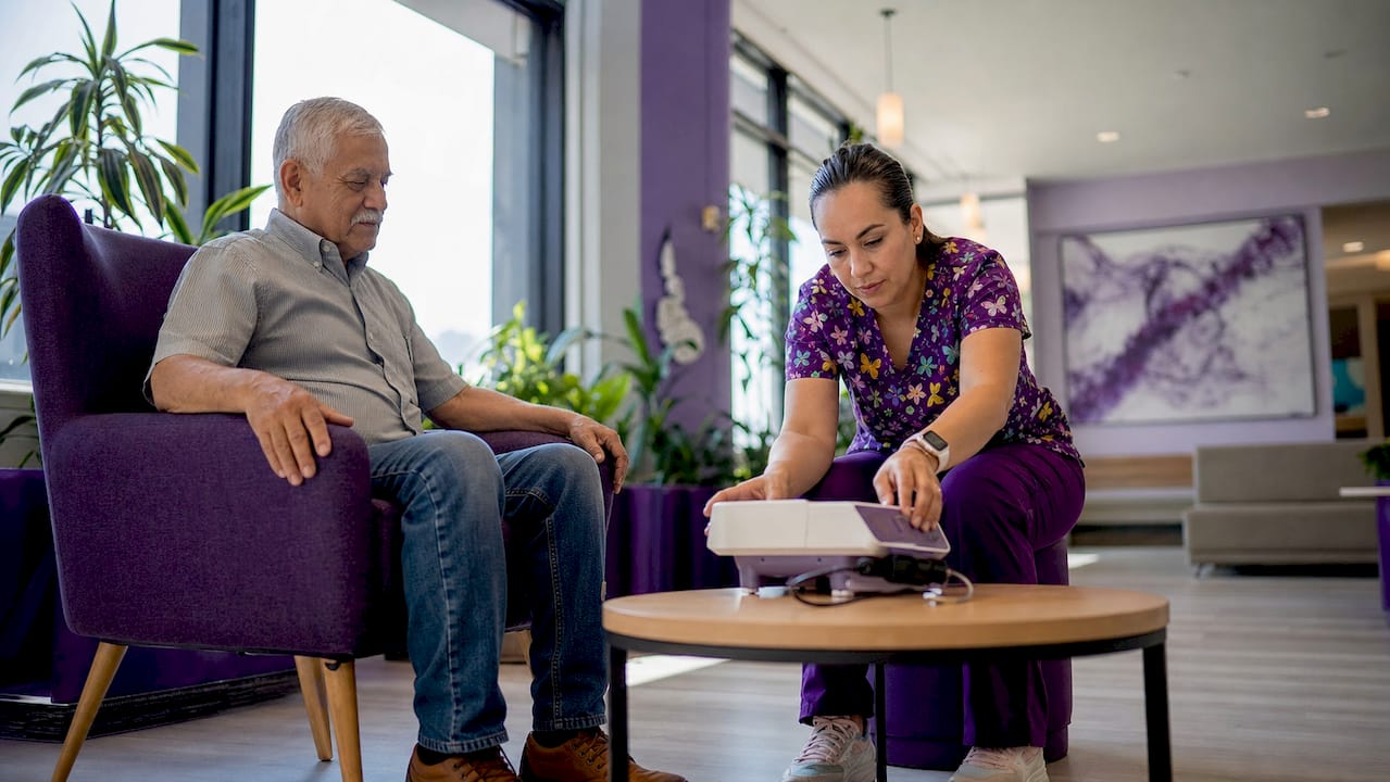 Nurse preparing bone density screening for patient