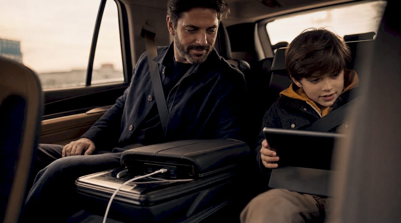 Parent plugging device into luxury SUV USB ports