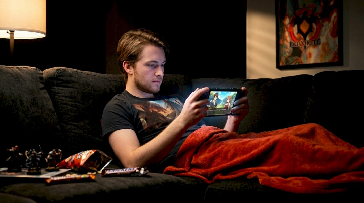 Gamer engaged with interactive novel device