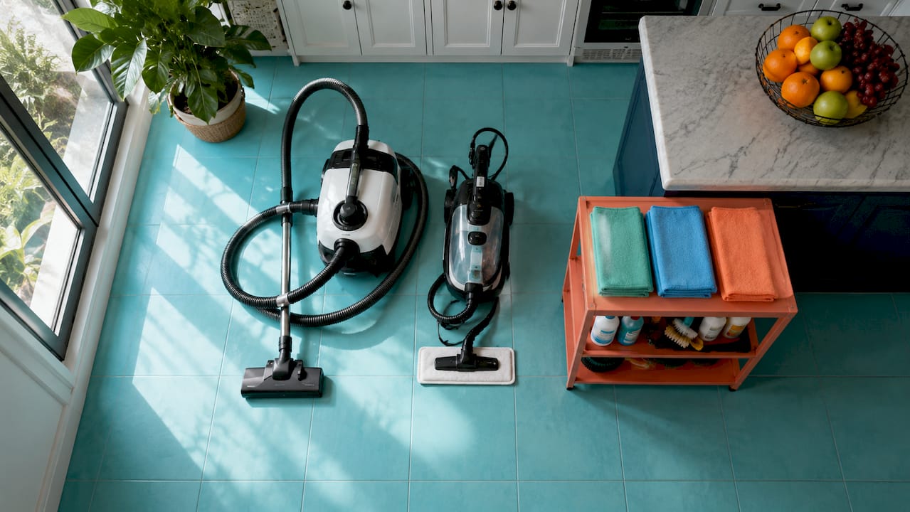 Professional cleaning tools on hardwood floor