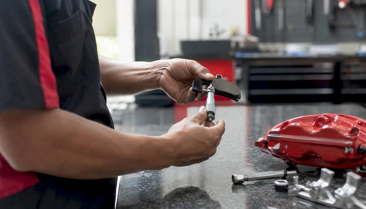 Close-up of brake pad measurement