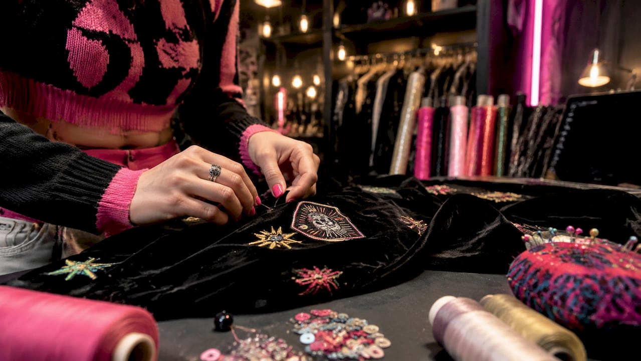 Hands sewing premium streetwear fabric
