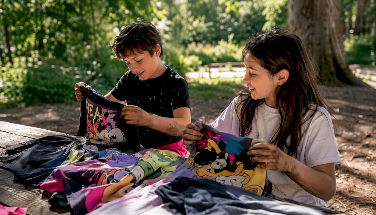 Children's graphic streetwear t-shirts on table