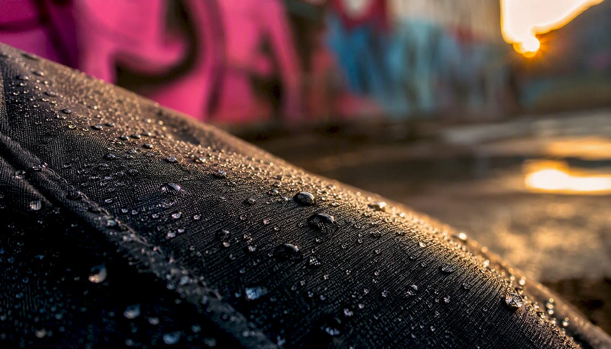 Water droplets beading on synthetic fabric