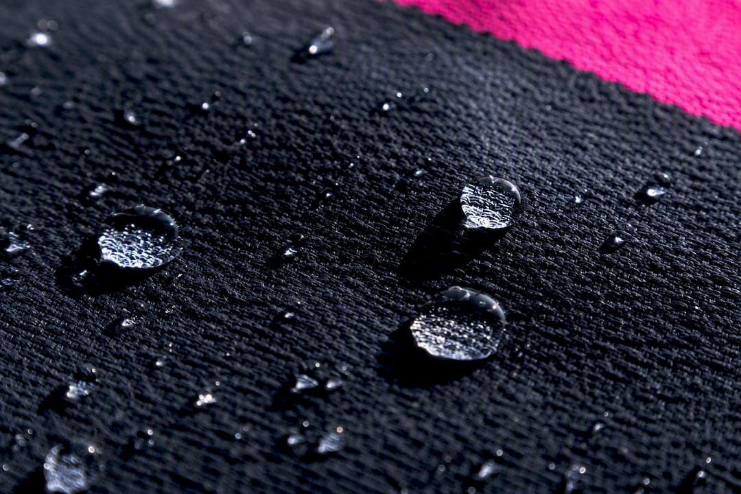 Macro water droplets on treated fabric surface