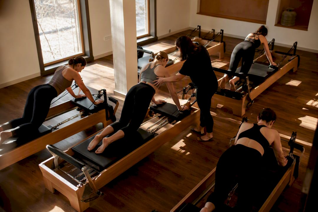 Small group Pilates reformer session in boutique studio