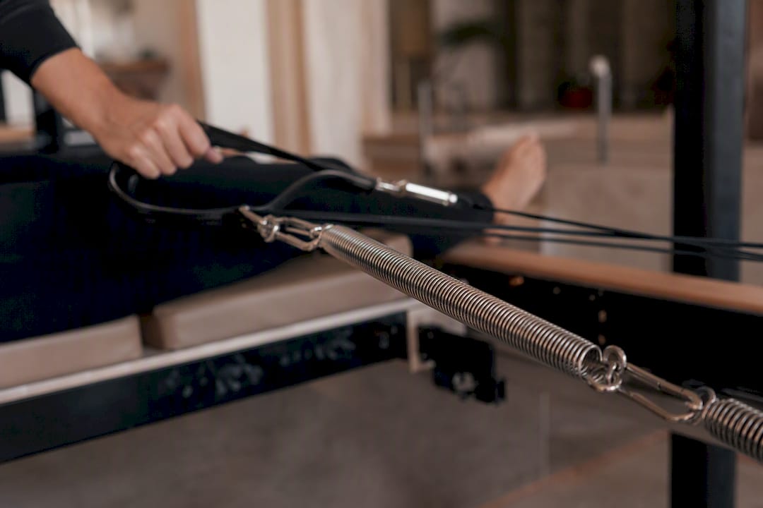 Pilates reformer springs under tension