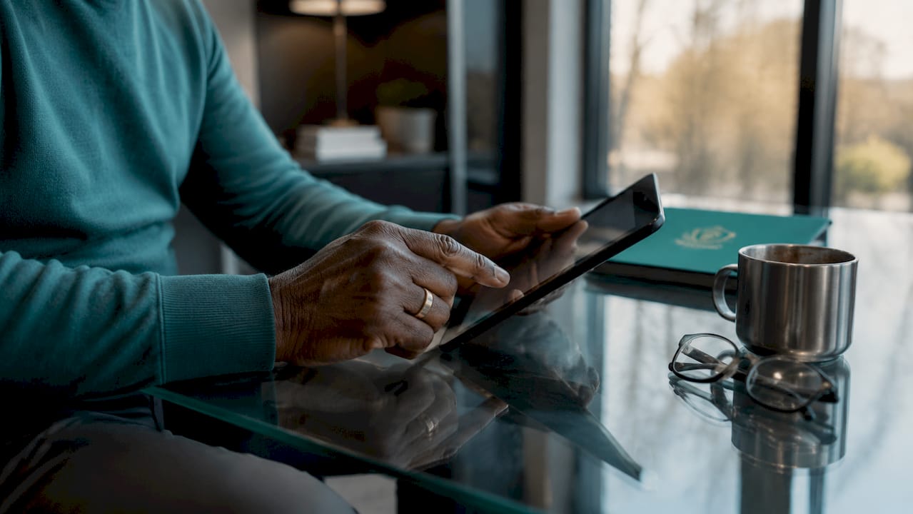 Hands inspecting mobile device for threats at home