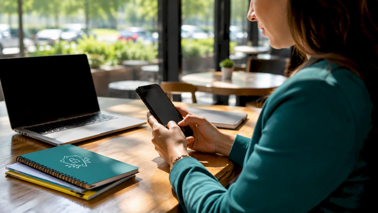 Hands using smartphone for automated enrollment