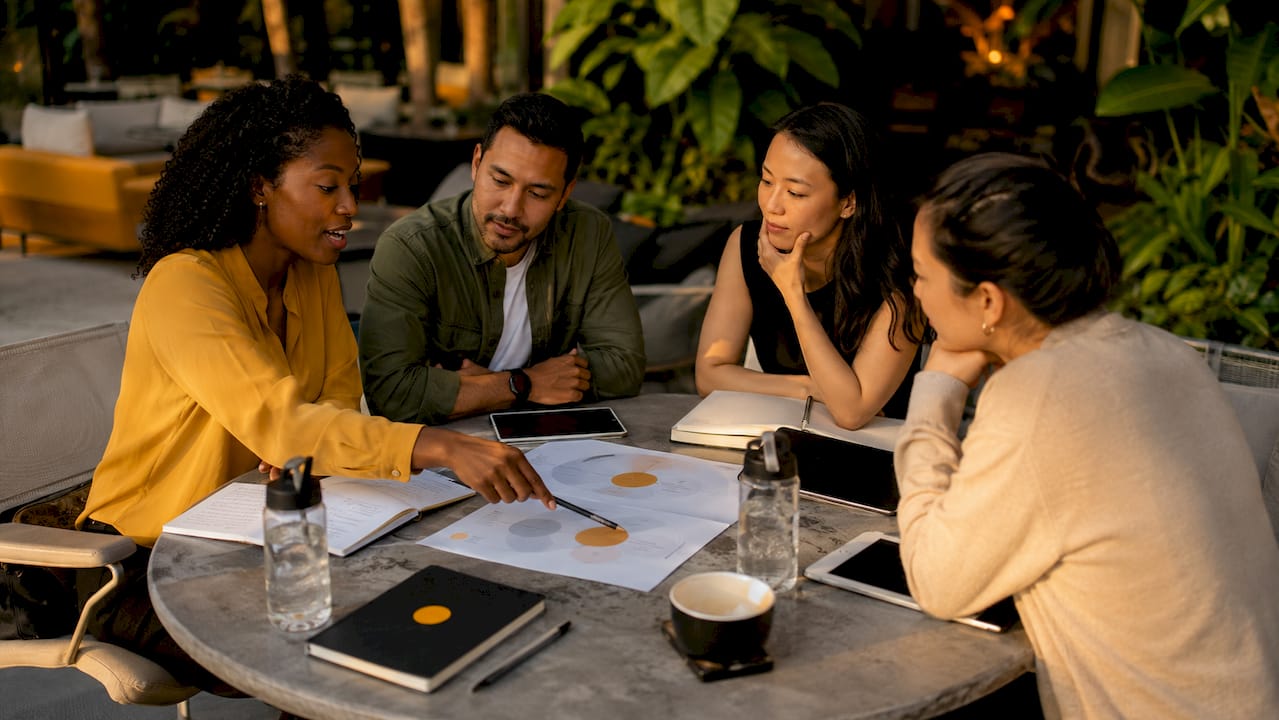 Sales team collaborating around conversation frameworks