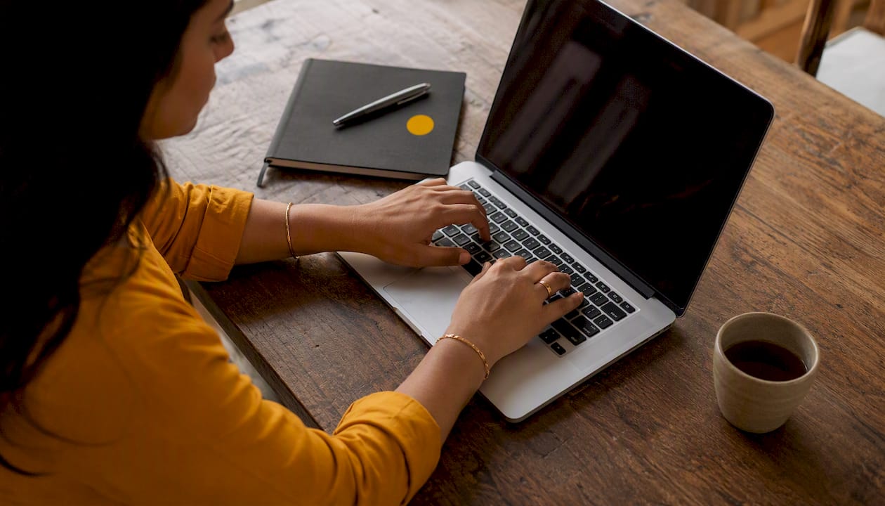 Hands typing during AI sales role-play