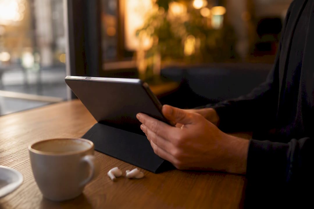 Hands holding digital tablet for training