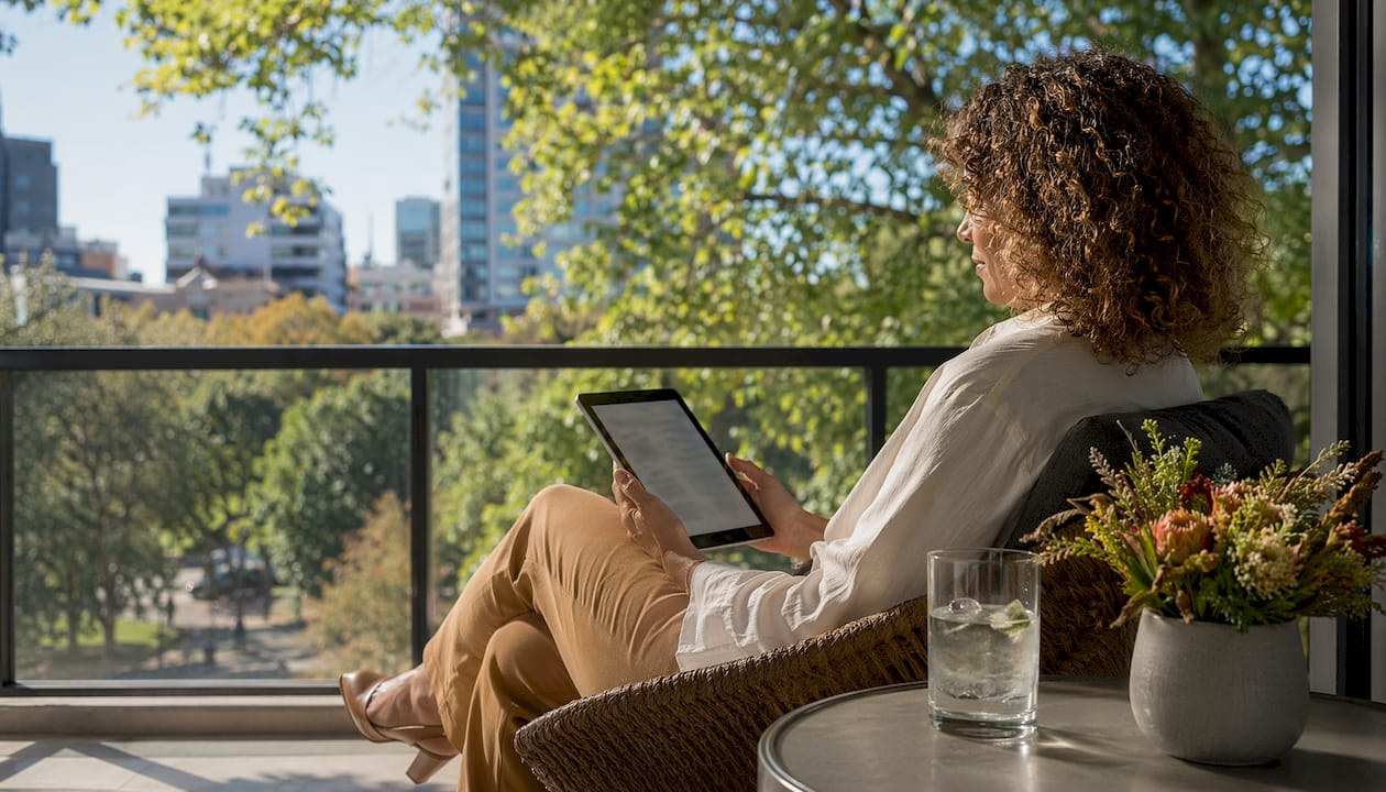 Landlord reviewing rental data on tablet indoors