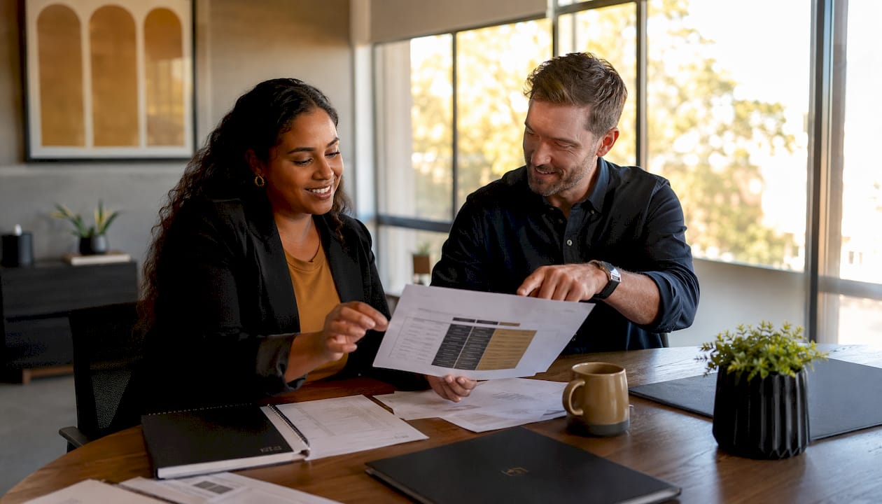 Two property managers discussing service comparison
