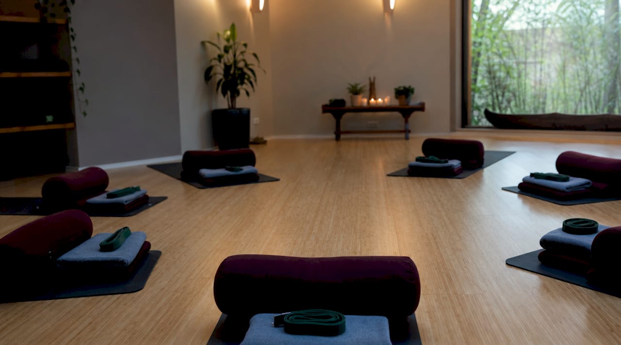 Overhead view of yoga mats with props arranged