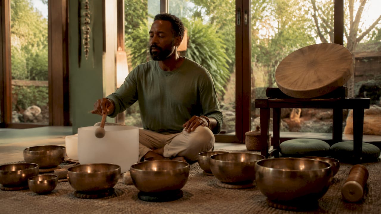 Sound therapist playing Tibetan singing bowl