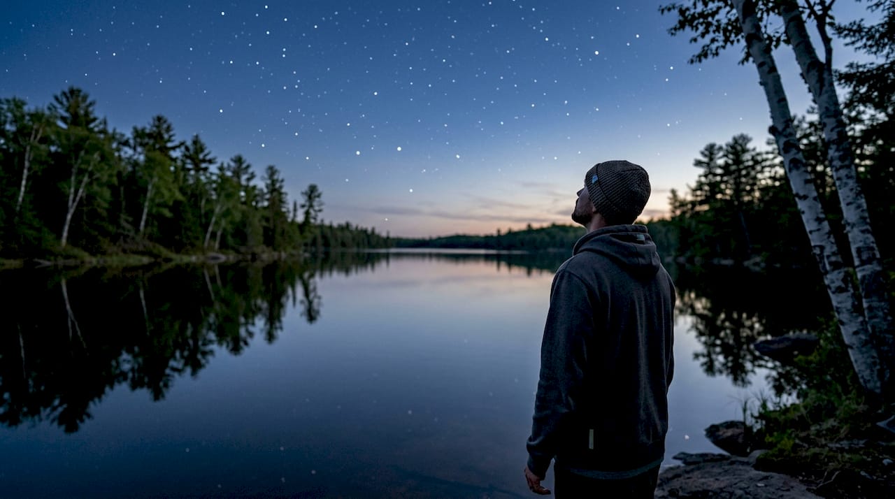 Lakeshore in Northwoods under starry sky