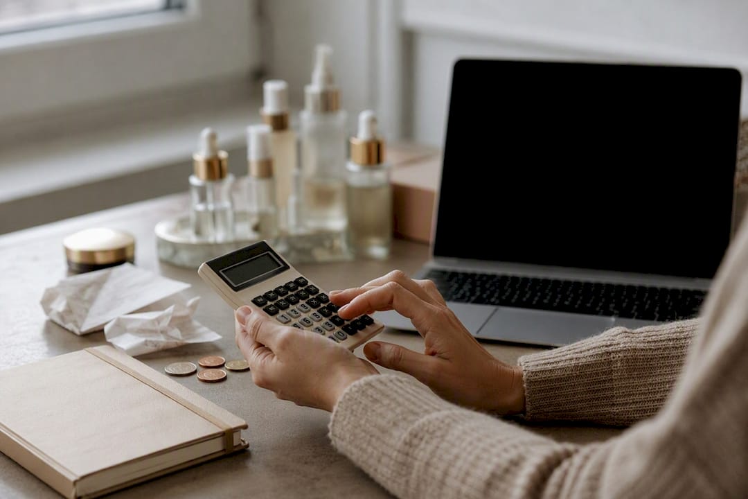 Hands calculating skincare discount value
