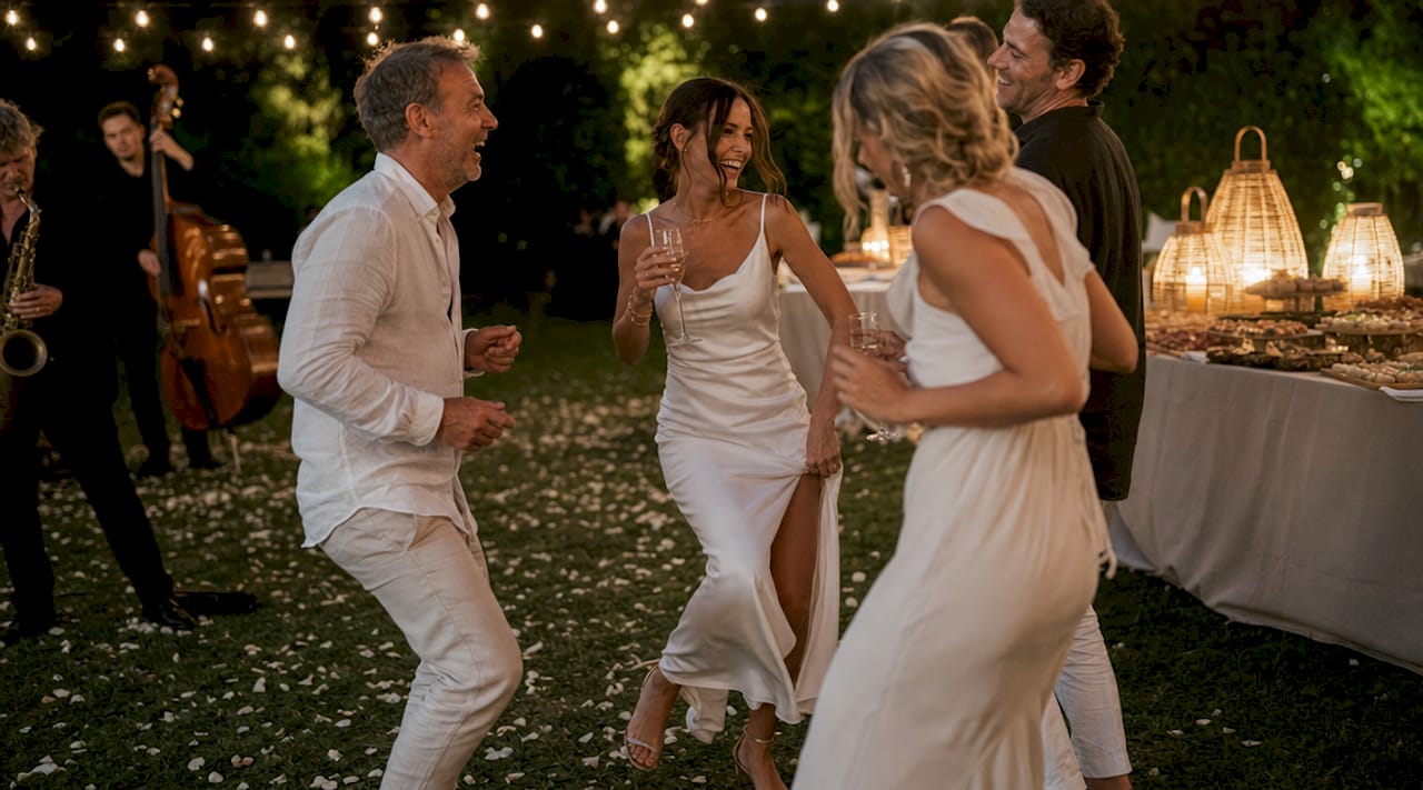 Guests dancing and dining at wedding reception