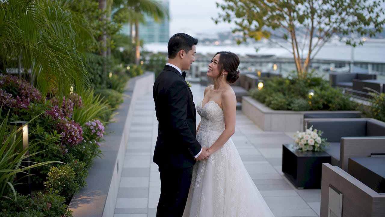 Bride and groom on Hilton San Diego waterfront terrace