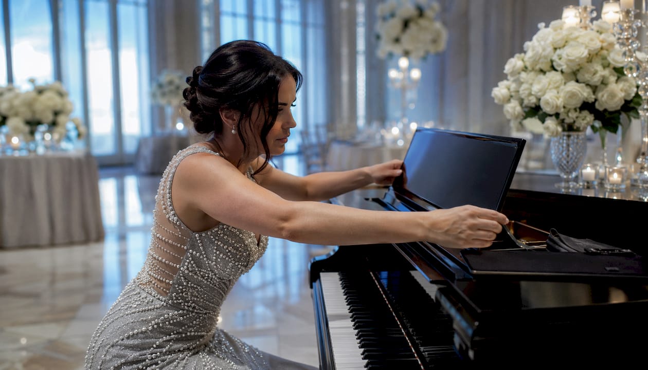 Gala pianist setting up piano at California event