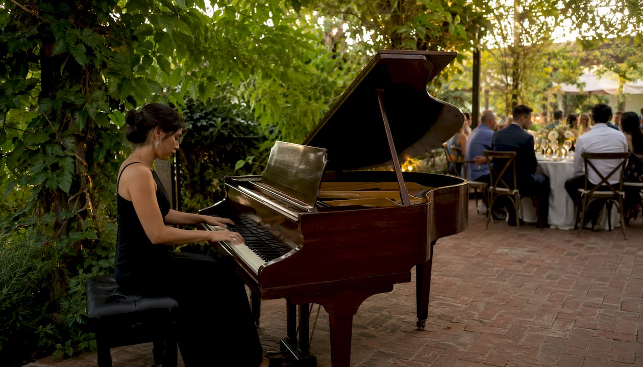 Pianist performing live music at winery wedding