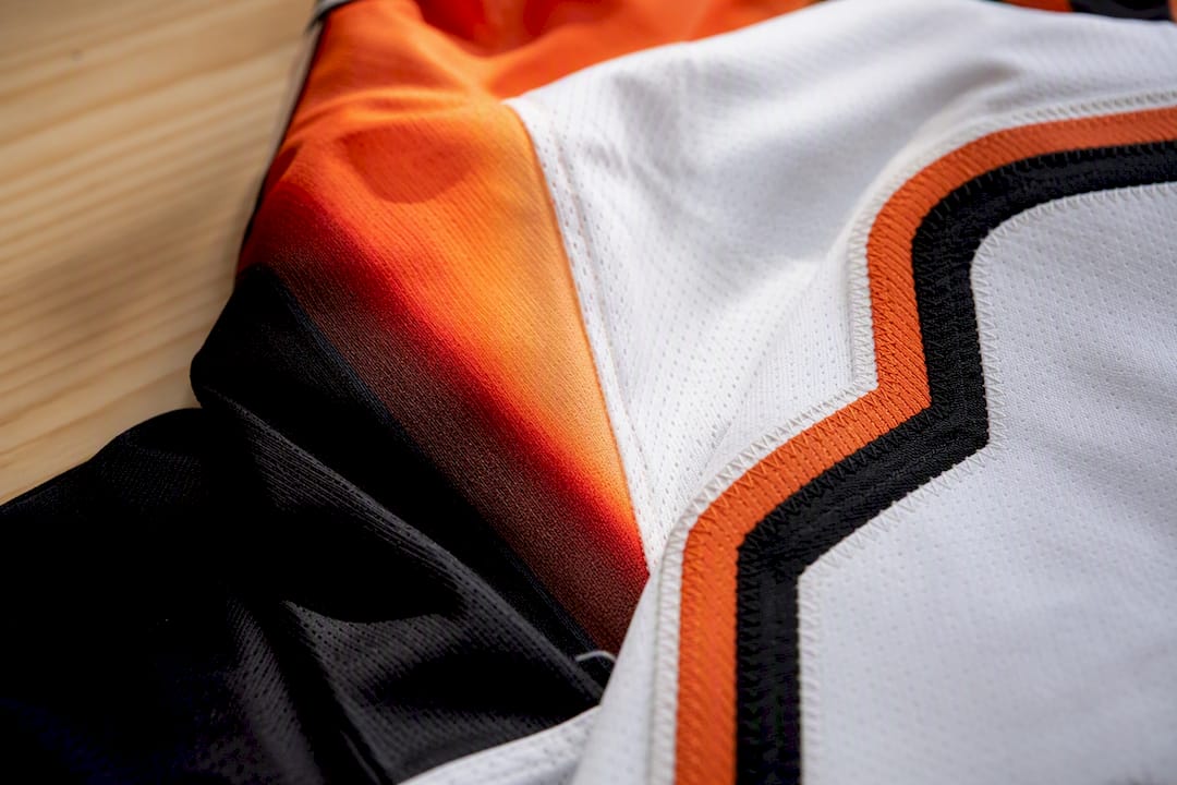 Hockey jersey fabric showing sublimation and embroidery close-up