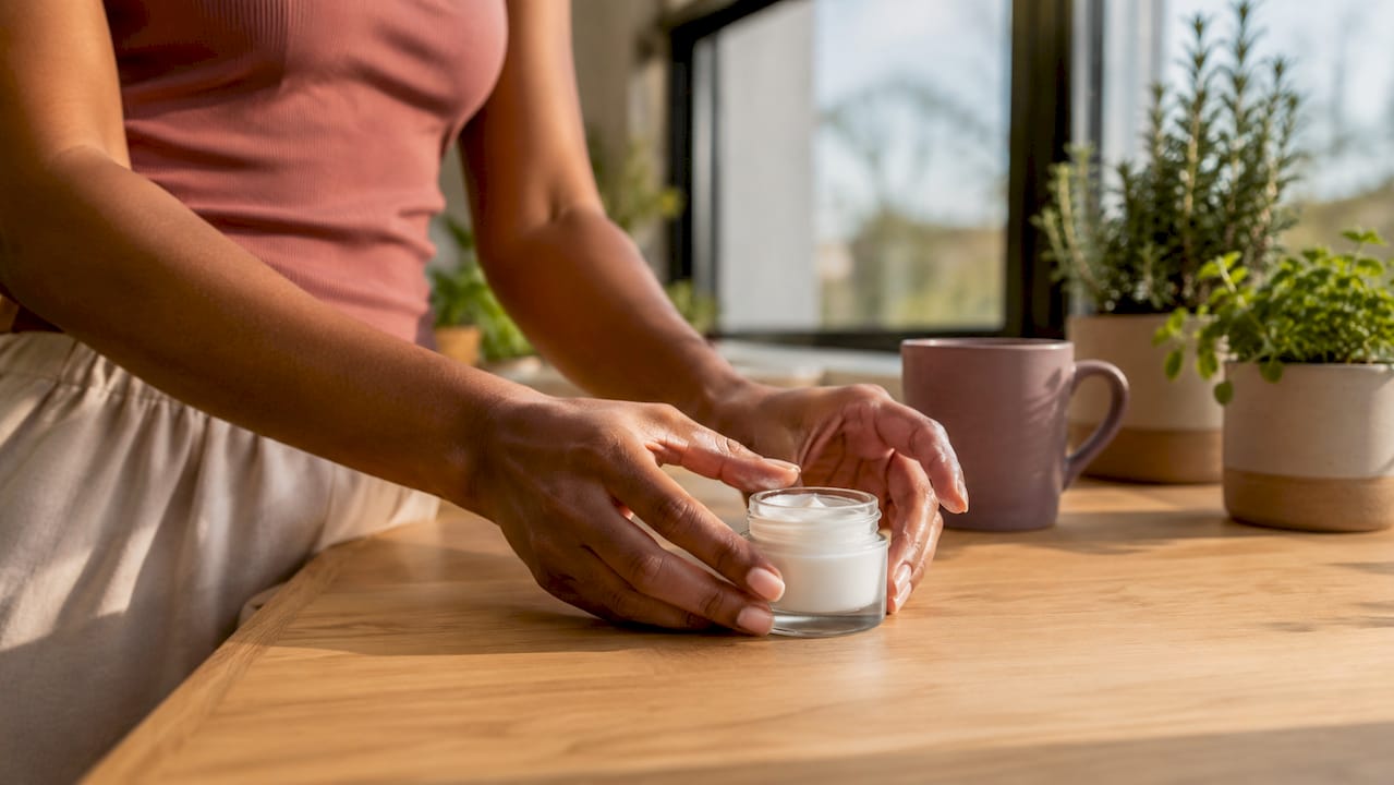Hands holding moisturizing cream for skin barrier