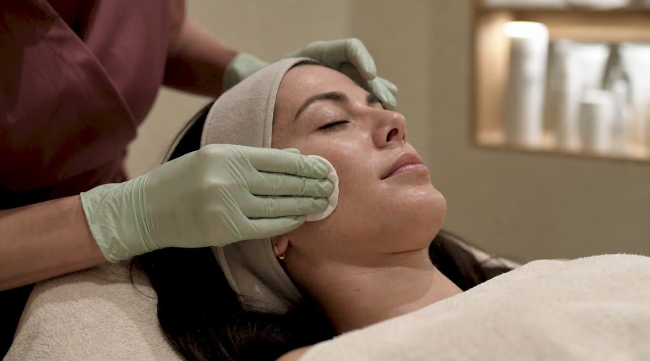 Close-up of chemical peel application on cheek