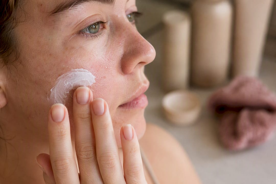 Close-up of mineral sunscreen being applied to skin