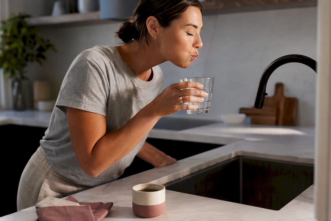 Woman rinsing after drinking coffee