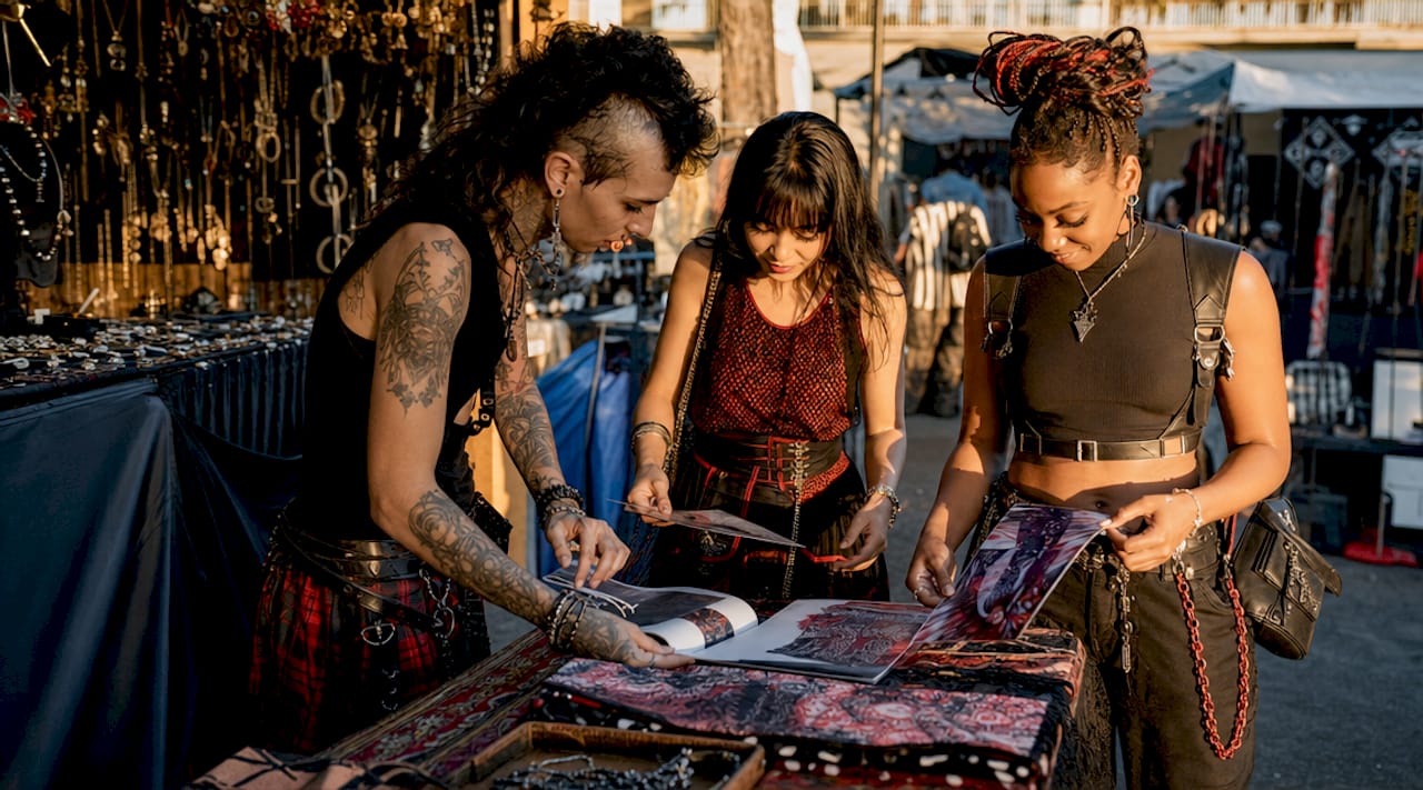 People reviewing fashion lookbooks and samples