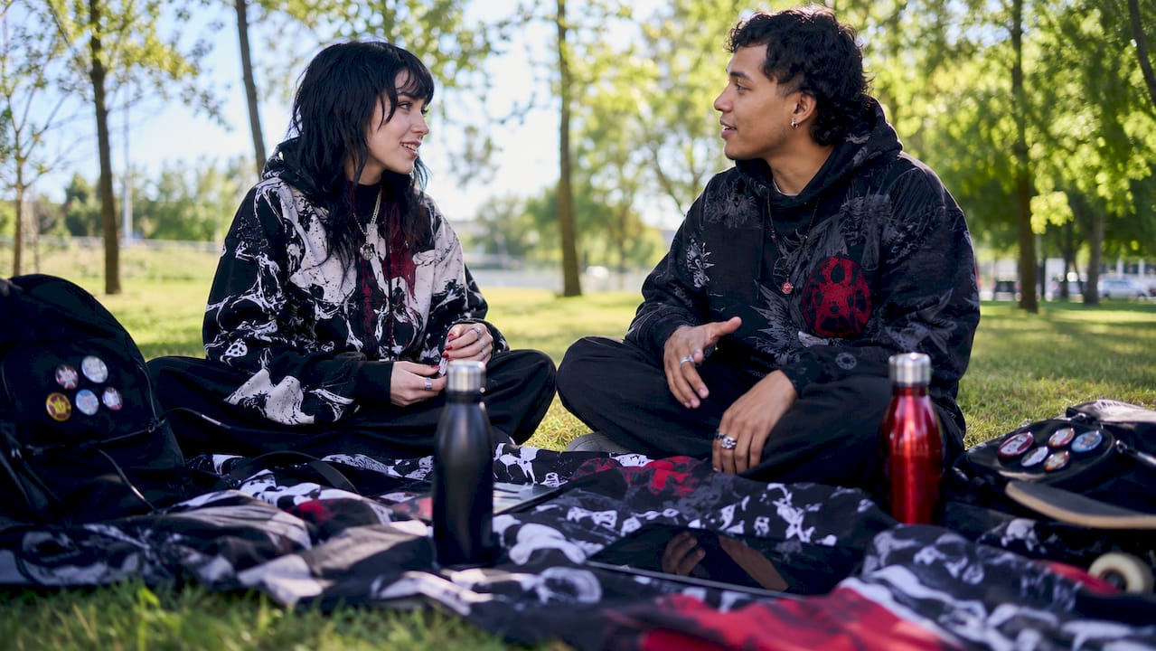 Two gamers discussing underground streetwear brands