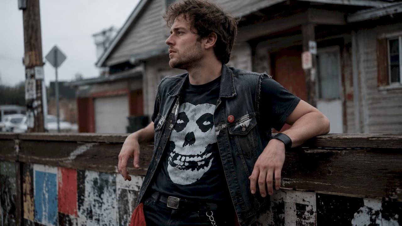 Man wearing a Nirvana graphic tee outdoors