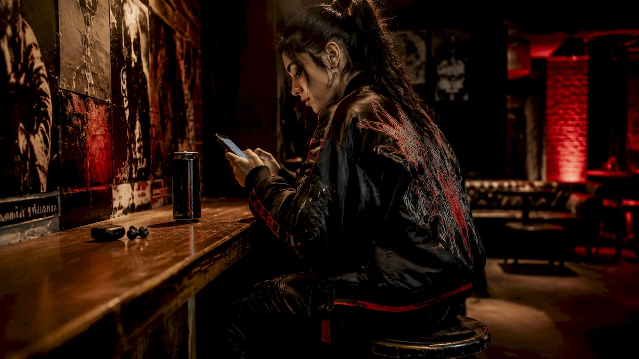 Female esports athlete wearing performance streetwear indoors