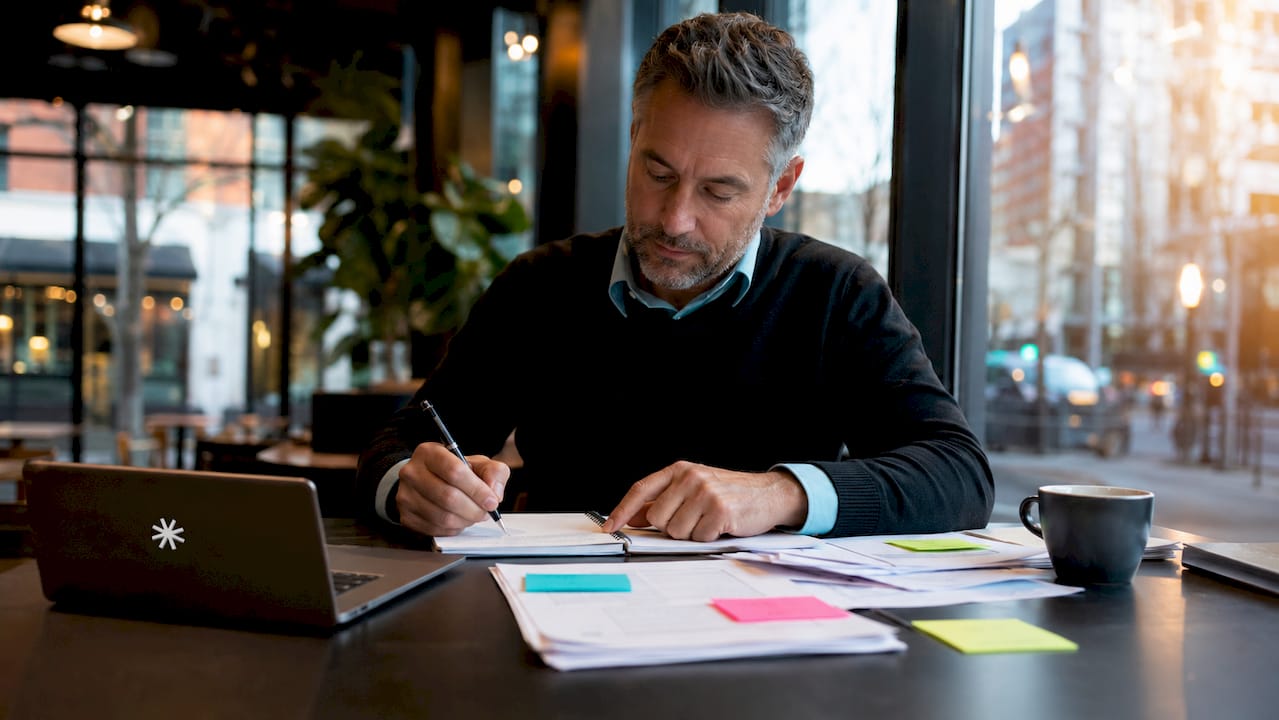 Man organizing work tasks representing personality type