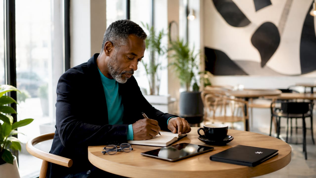 Man managing portfolio roles at workspace