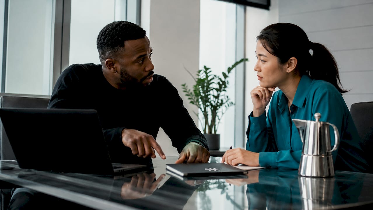 Two colleagues discussing dream job criteria