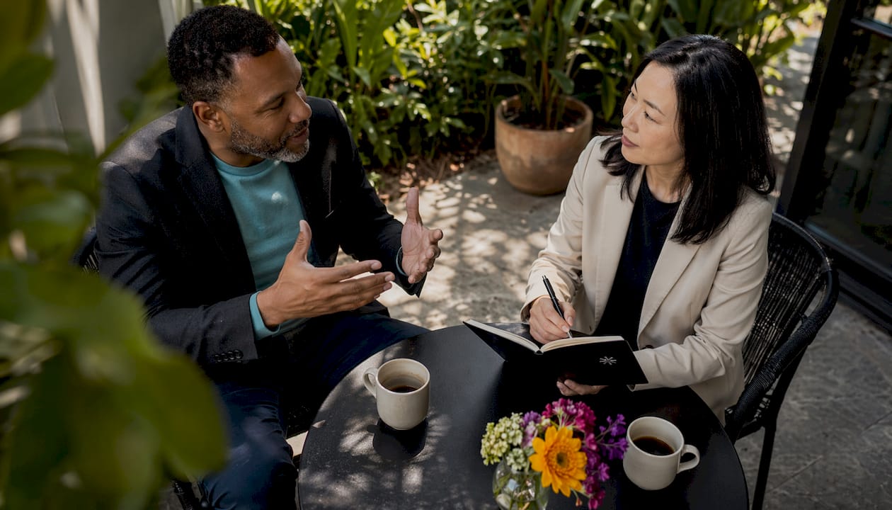 Two professionals discussing career change